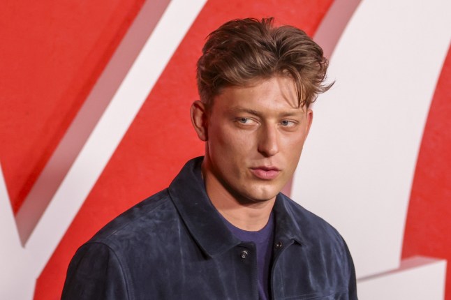 British actor Tom Francis attends the red carpet for the premiere of Netflix's 'You' wearing a blue shirt