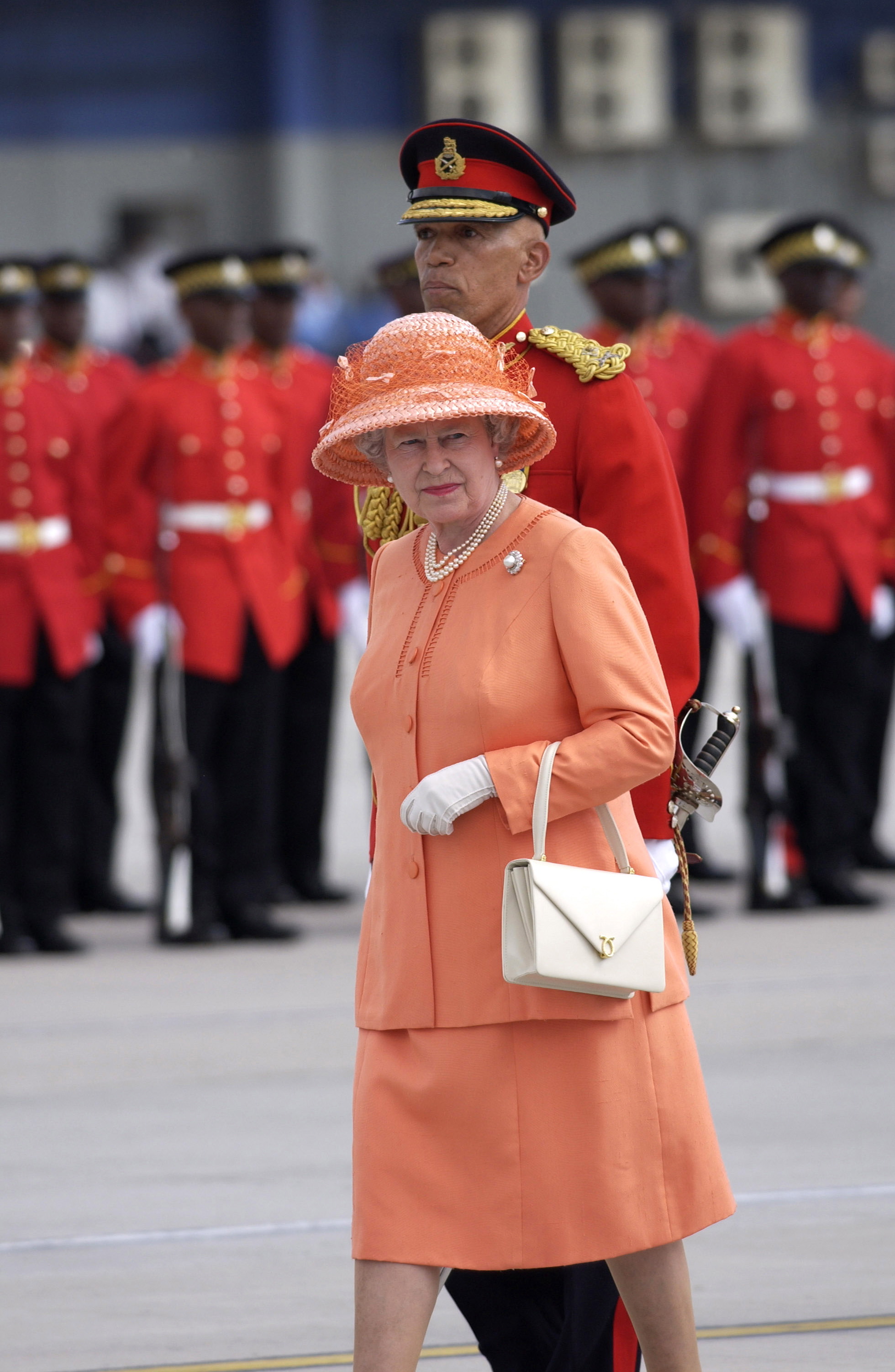 Queen Elizabeth in a peach suit