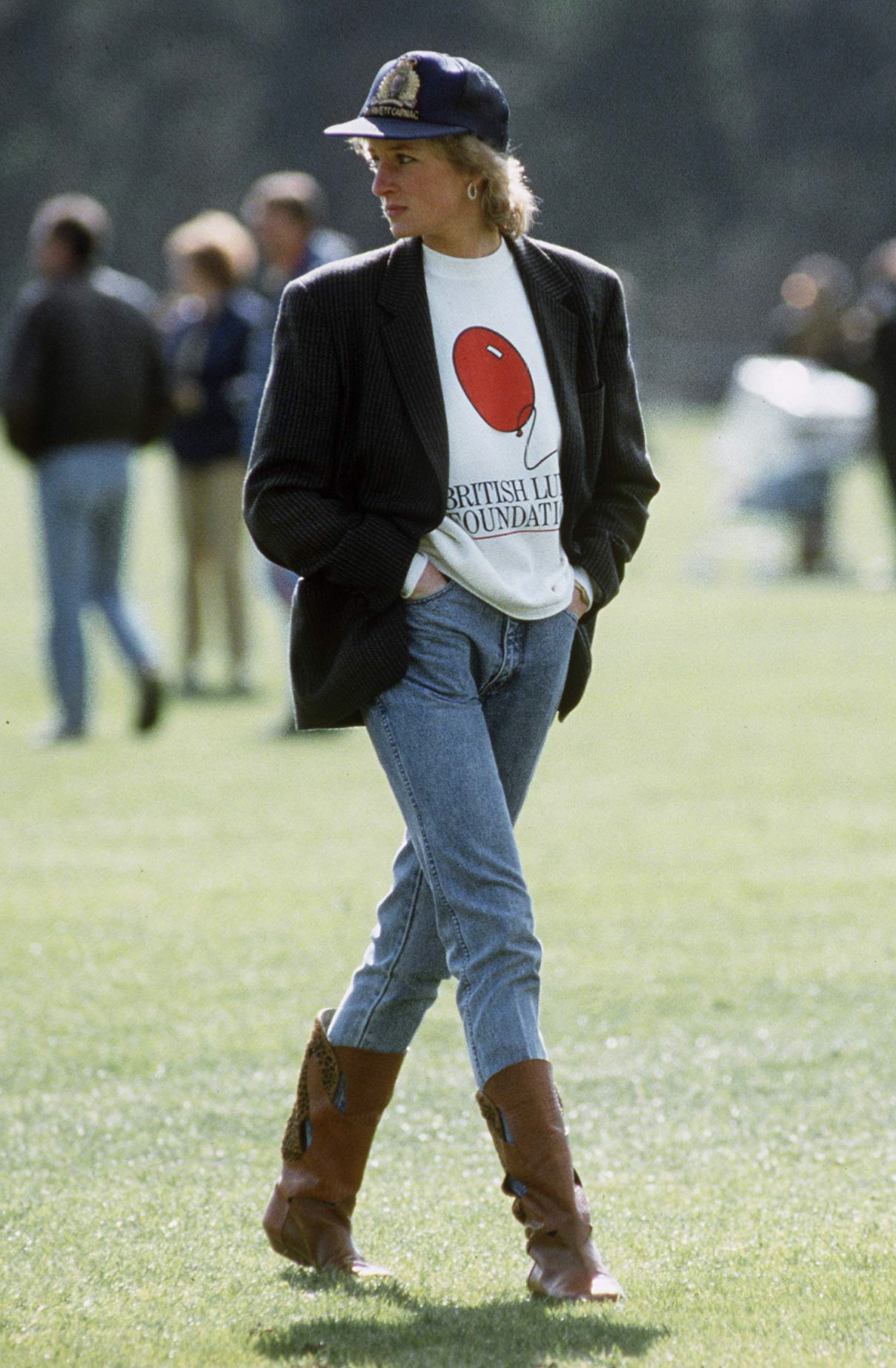 WINDSOR, UNITED KINGDOM - MAY 02: Diana, Princess Of Wales At Guards Polo Club. The Princess Is Casually Dressed In A Sweatshirt With The British Lung Foundation Logo On The Front, Jeans, Boots