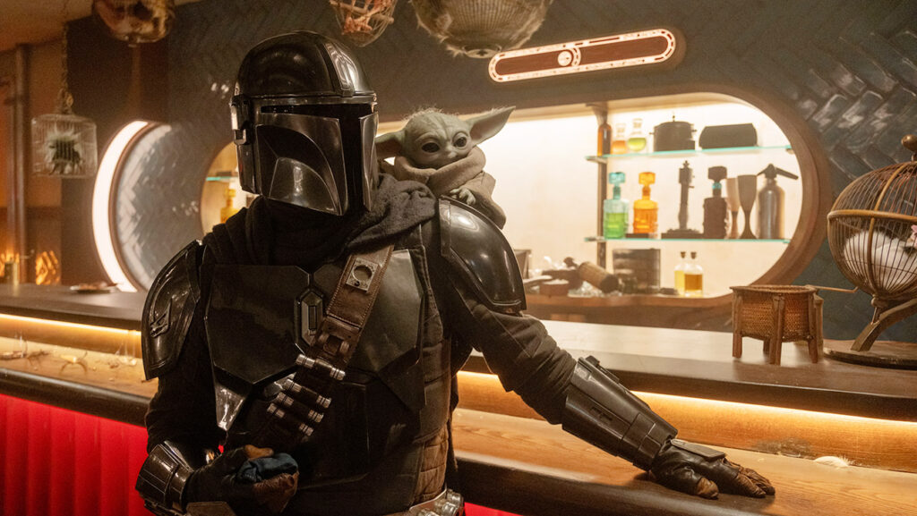 (L-R) Mandalorian (Pedro Pascal) and Grogu in Lucasfilm's The Mandalorian and Grogu