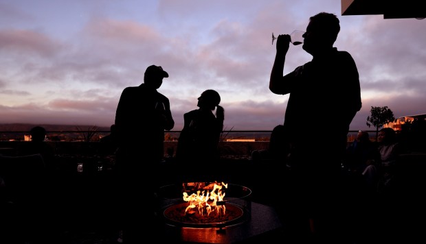 People take in a sunset on the rooftop sports bar and Aya Restaurant at the grand opening of Graton Resort and Casino's rooftop restaurant, AYA, Thursday, May 7, 2026, near Rohnert Park. (Kent Porter / The Press Democrat)