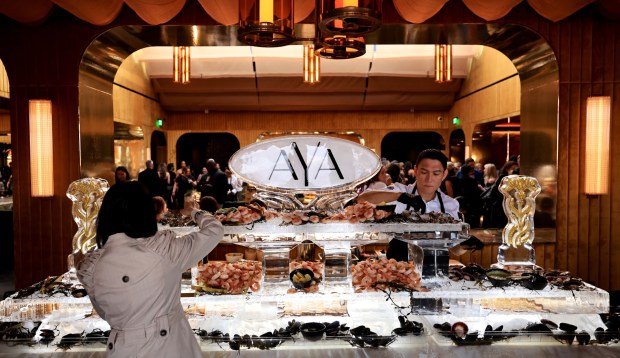 Guests gather around the seafood bar at the grand opening of Graton Resort and Casino's rooftop restaurant, AYA, Thursday, May 7, 2026, near Rohnert Park. (Kent Porter / The Press Democrat)