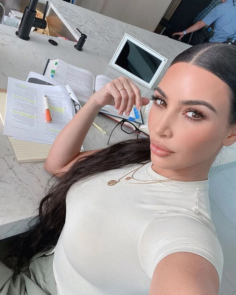 Kardashian (seen here taking a selfie while studying) has taken the California Bar exam once and the California “baby bar” test three times before she passed on her fourth attempt in 2021. kimkardashian/Instagram