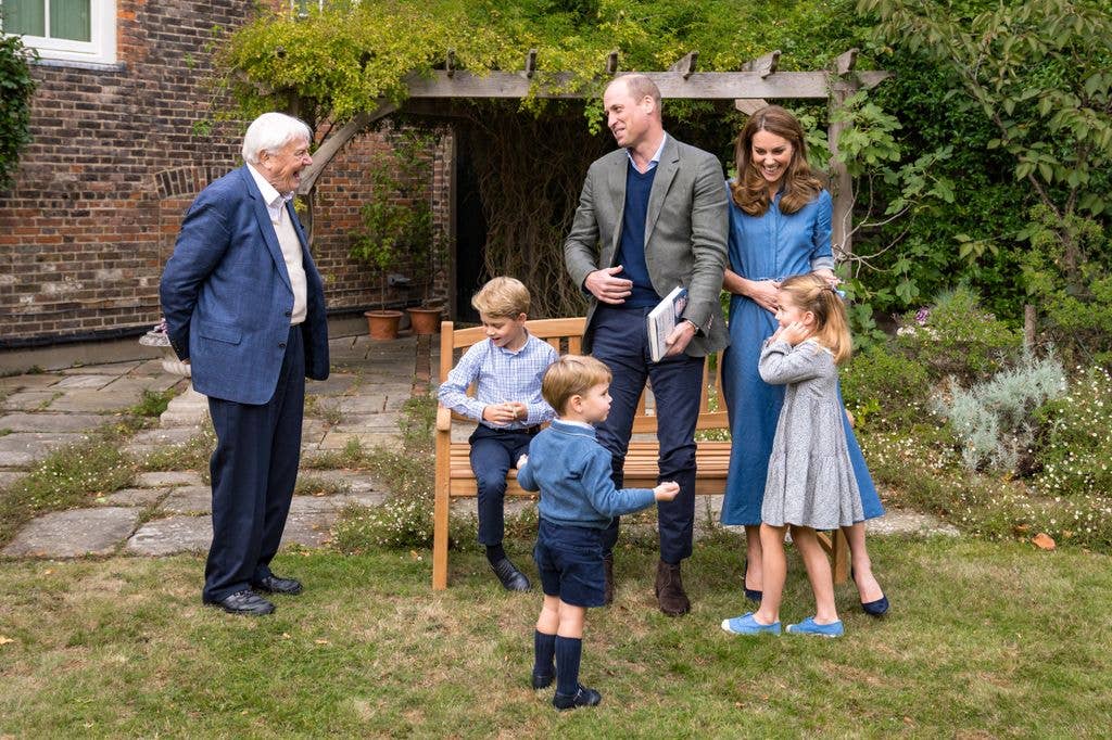 The Prince and Princess of Wales, Prince George, Princess Charlotte and Prince Louis with Sir David Attenborough in the gardens of Kensington Palace in London