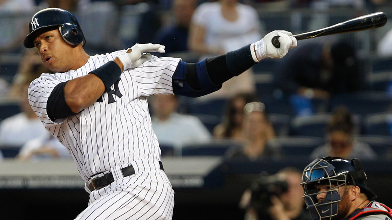 Alex Rodriguex swings bat in a baseball game.