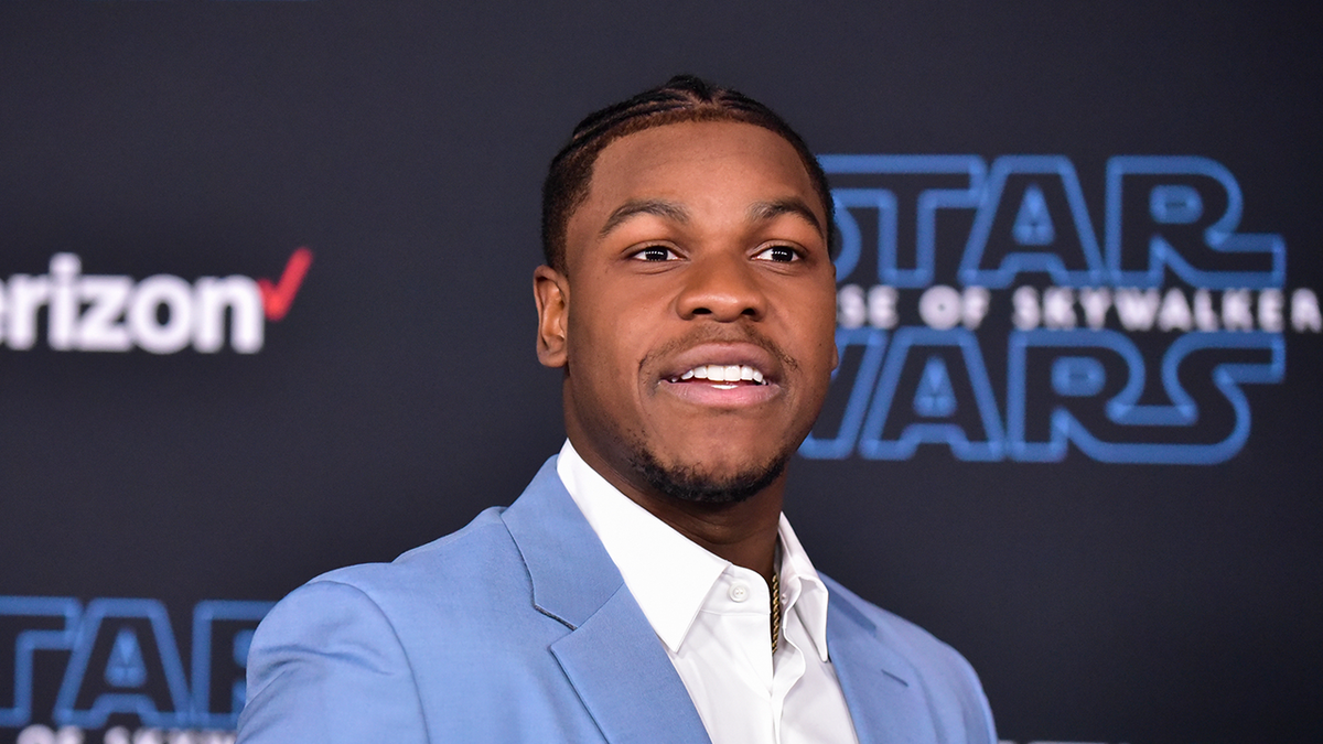 John Boyega standing at Star Wars premiere event
