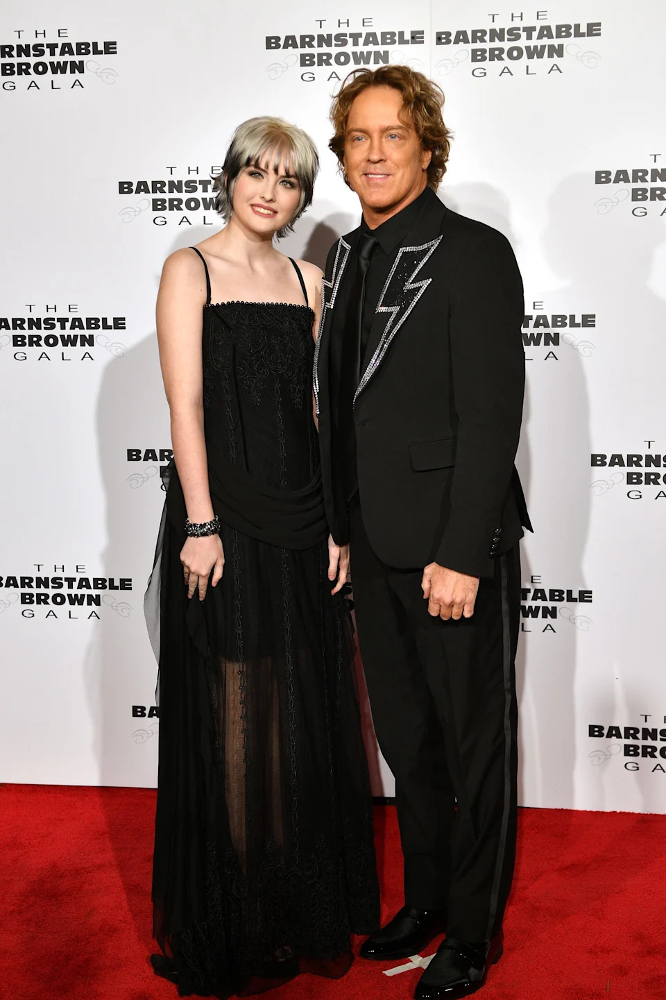 Dannielynn Birkhead and her father, Larry, on the red carpet at the Barnstable Brown Party ahead of the Kentucky Derby.