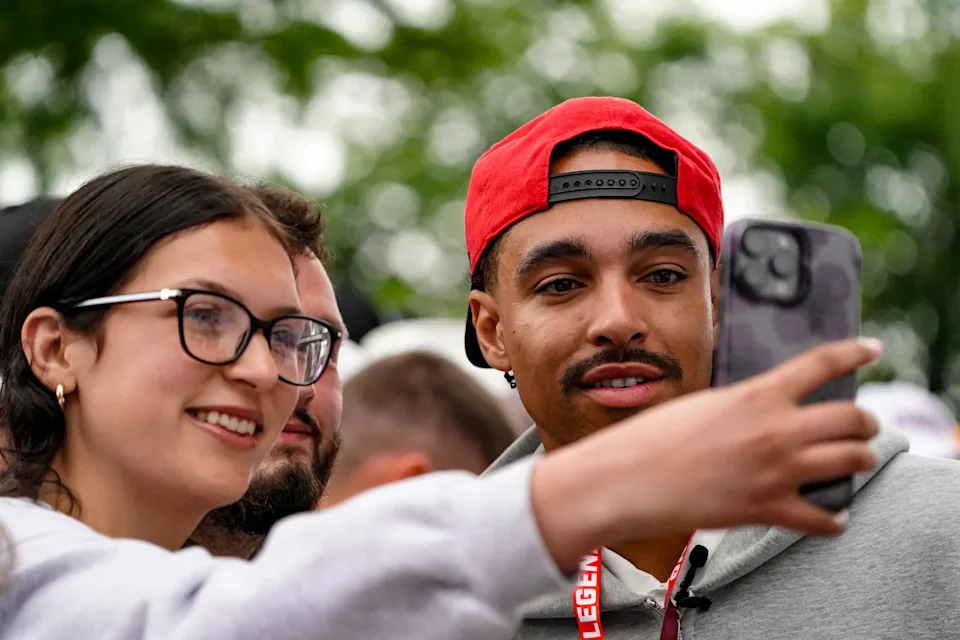 Indiana Pacers guard Andrew Nembhard, right, takes a photo with a fan on the celebrity red carpet on Sunday, May 24, 2026, during the 110th running of the Indianapolis 500 at Indianapolis Motor Speedway.