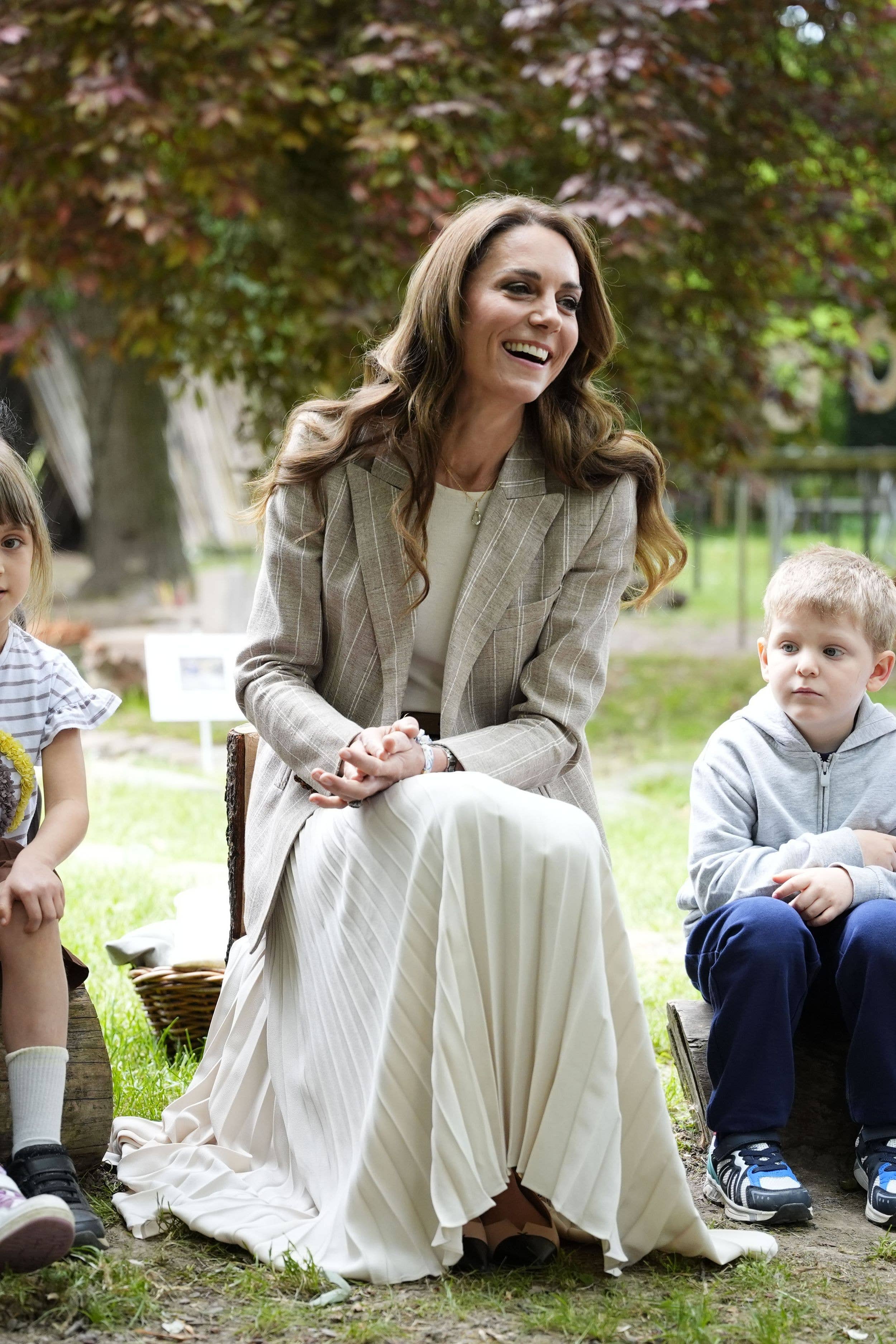 The Princess of Wales smiling outside in pinstripe blazer