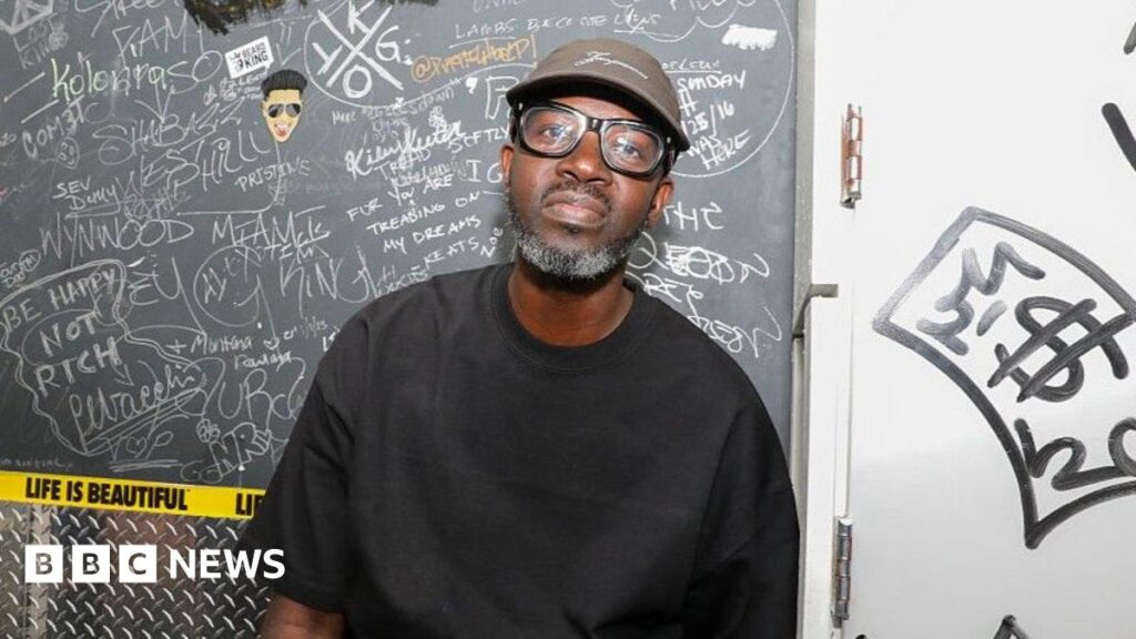 DJ Black Coffee stuns O2 crowds with orchestral show South African DJ Black Coffee performs for fans on his DJ decks. Fans are seen in the background dancing.