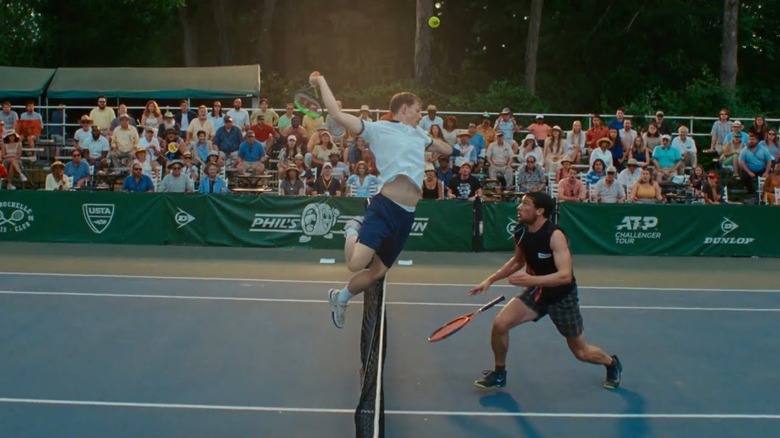 Art jumping to hit the ball and Patrick watching under him in Challengers