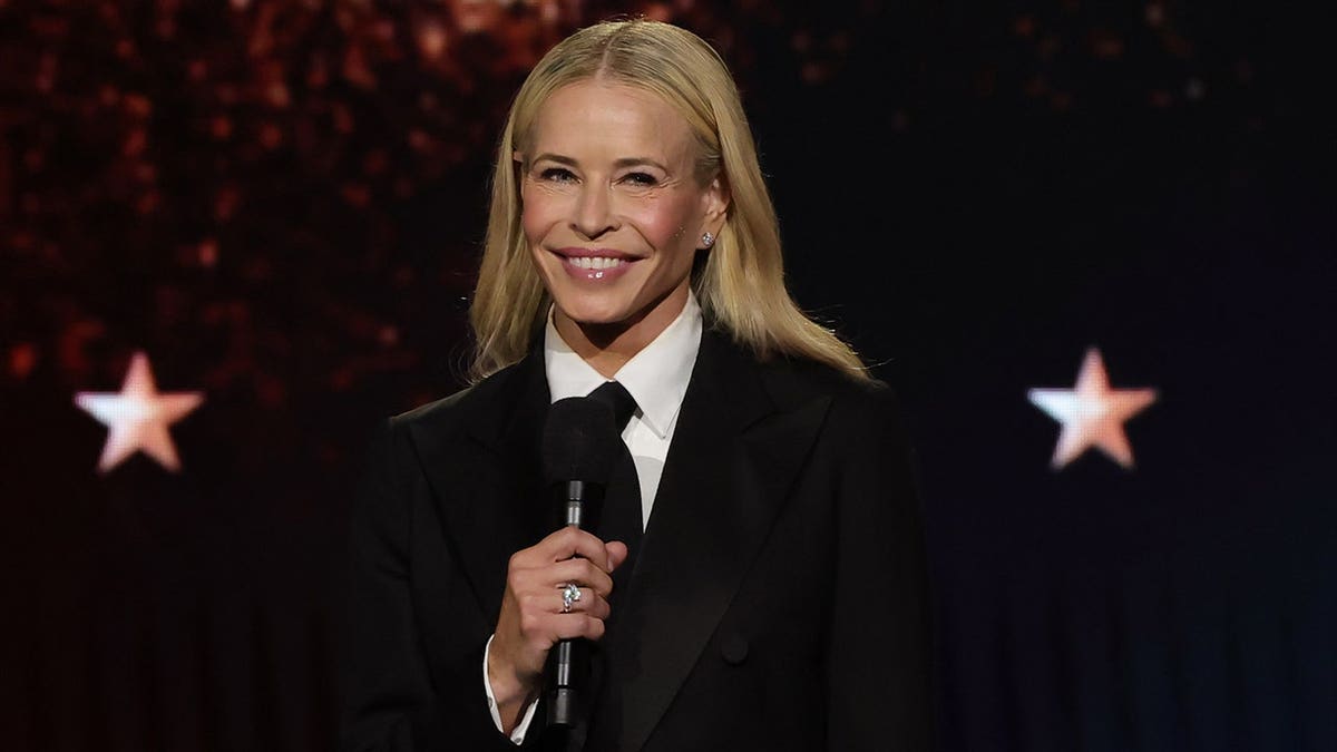 Chelsea Handler on stage in a suit hosting the Critic's Choice Awards in January 2026.