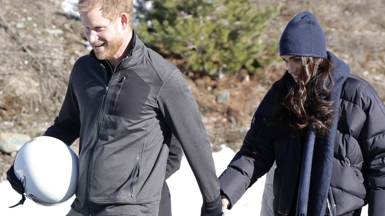 Meghan and Harry wear matching puffers at Canada's  Invictus Games