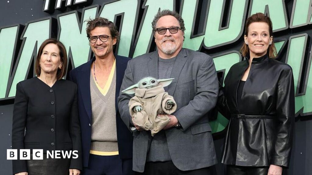 Kathleen Kennedy, Pedro Pascal, Jon Favreau, 'Grogu' and Sigourney Weaver attend the "Star Wars: The Mandalorian And Grogu" UK Fan Event at Cineworld Leicester Square on May 07, 2026 in London, England.