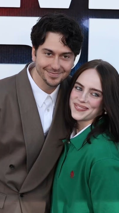 Billie Eilish hugs her boyfriend Nat Wolff and poses with her brother Finneas at the LA premiere of Billie Eilish – Hit Me Hard And Soft: The Tour