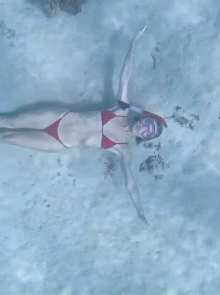 photo of julianne hough in red bikini wearing snorkel mask at bottom of the sea