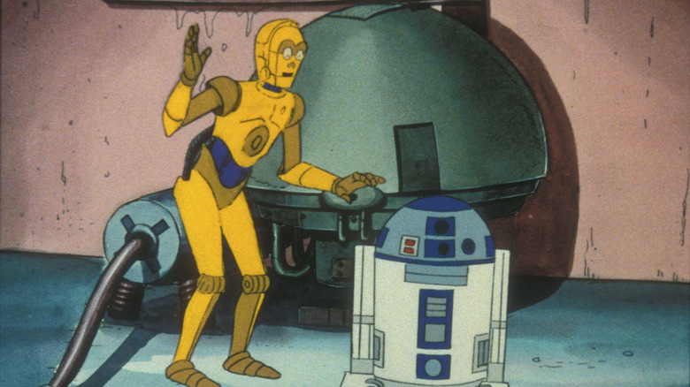 C-3PO and R2-D2 stand in front of a machine in Droids