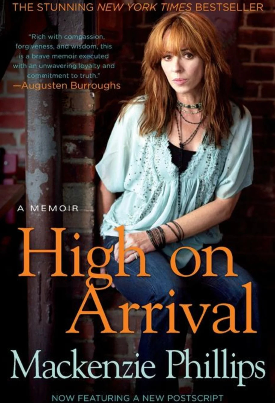 Book cover of "High on Arrival" by Mackenzie Phillips, featuring the author seated, with a quote by Augusten Burroughs at the top