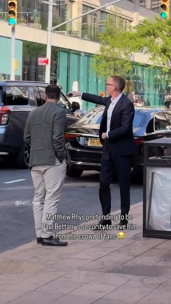 Matthew Rhys pretending to be Paul Bettany's security to save him from the crowd of fans at the Lincoln Center Theater Spring Gala in NYC