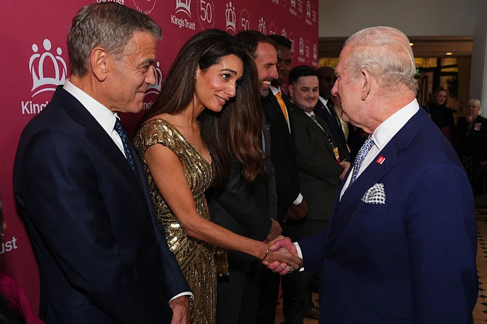 britains king charles iii shakes hands with amal clooney as he arrives to attend a kings trust celebration at the royal albert hall in london on may 11, 2026, to celebrate the 50th anniversary of the kings trust. (photo by aaron chown / pool / afp via getty images)