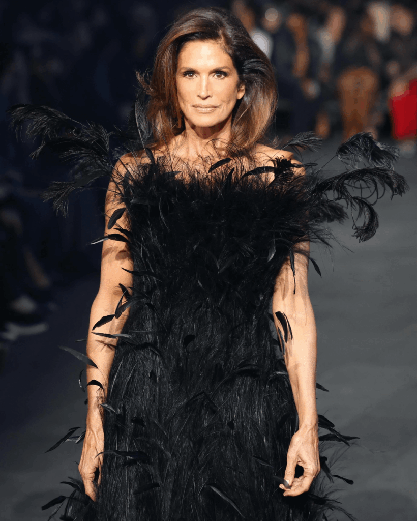 Cindy Crawford debuting in her first Gucci runway show, by closing the Gucci Resort 2027 show in Times Square, NYC.
