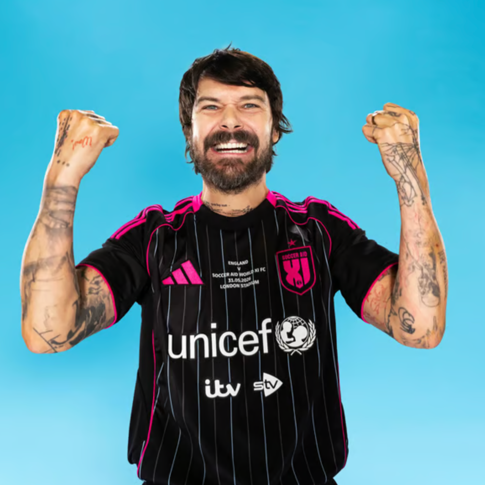 Soccer aid line up person celebrating in a sports jersey