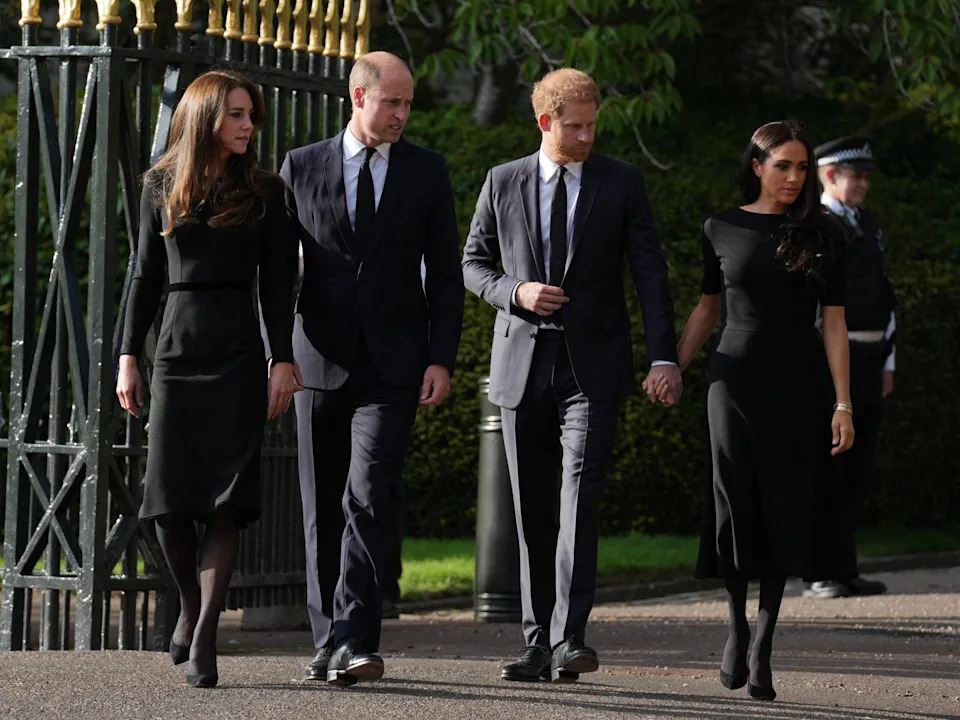 The Prince and Princess of Wales along with Prince Harry and Meghan Markle the Duke and Duchess of Sussex view the tributes at Windsor
