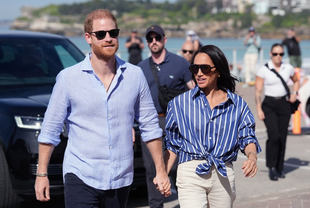 Prince Harry and Meghan, the Duke and Duchess of Sussex, arrive to meet volunteer first responders from Bondi Surf Bathers’ Life Saving Club, during a visit to Bondi Beach, Australia on April 17. Photo: Pool Photo via AP