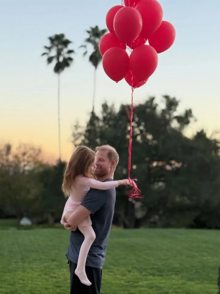 Prince Harry holds Princess Lilibet in a father-daughter photo shared to Meghan Markle's Instagram account on February 14, 2026.Credit: Meghan Markle/Instagram
