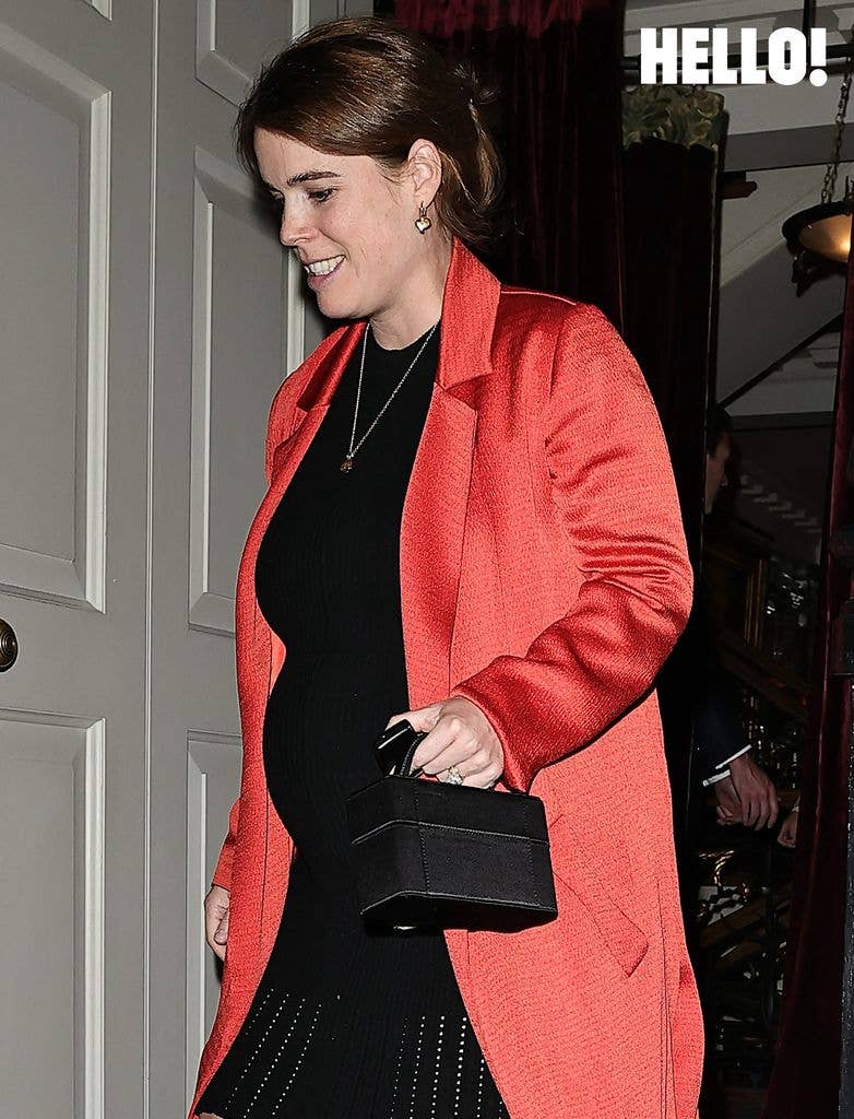 Eugenie showed off her baby bump in a fitted black dress