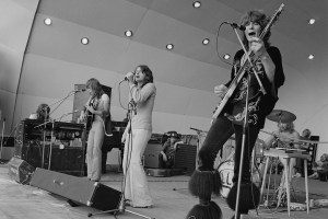 English progressive rock group Yes perform live on stage at the Crystal Palace Garden Party II at Crystal Palace Bowl in London, England on 31st July 1971. The band members are, from left, Tony Kaye (?), Steve Howe, Jon Anderson, Chris Squire and Bill Bruford. (Photo by Michael Putland/Getty Images)