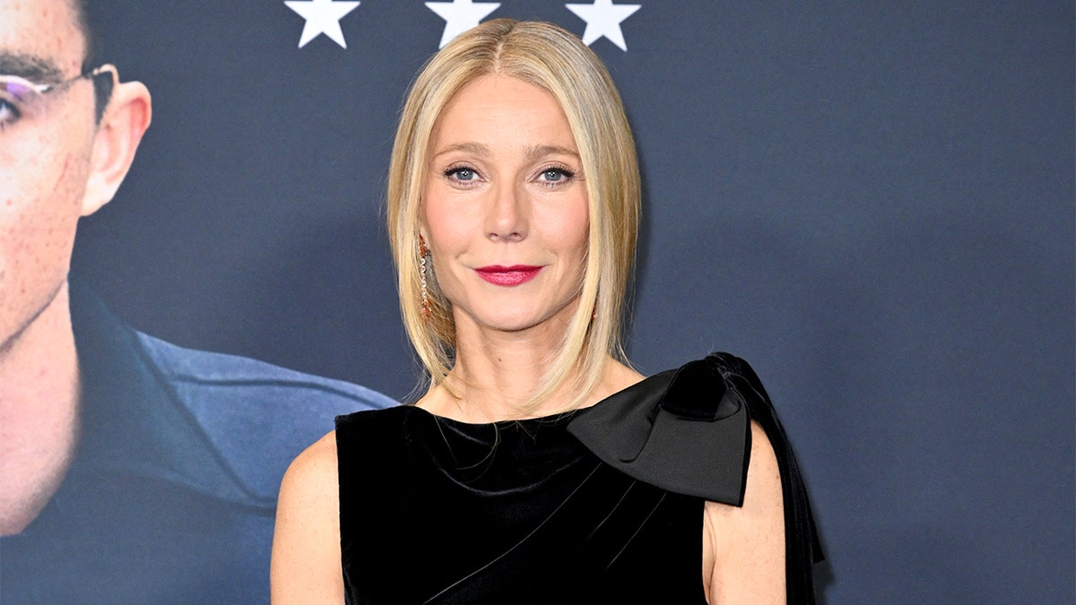 Gwyneth Paltrow standing on the red carpet at a movie premiere in New York