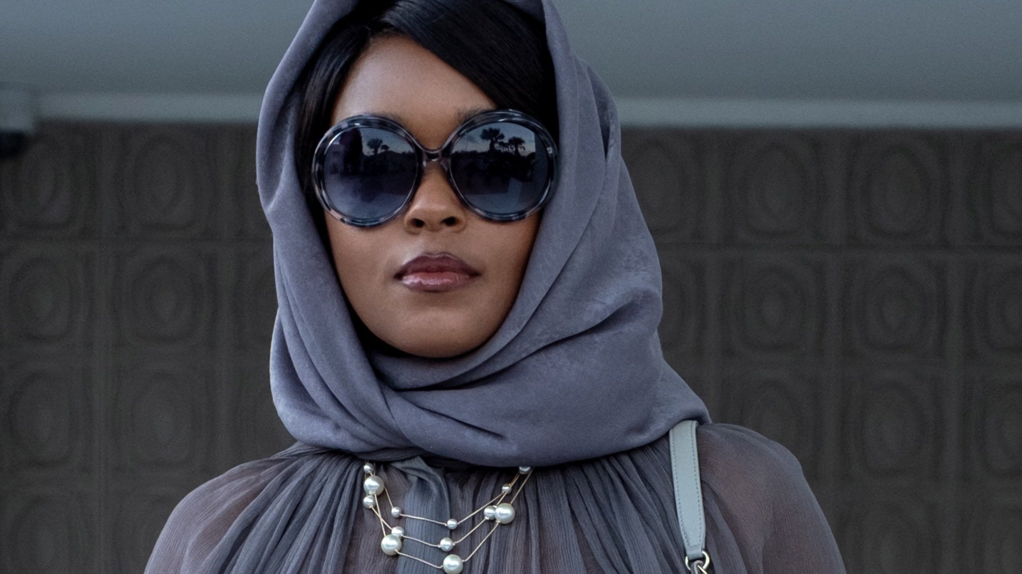Janelle Monáe as Angie, the new wife, in