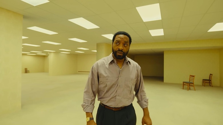 Chiwetel Ejiofor as Clark looking confused as he walks through the backrooms in Backrooms