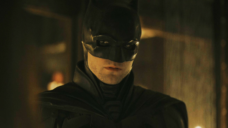 Robert Pattinson's Batman stands in a corridor in The Batman