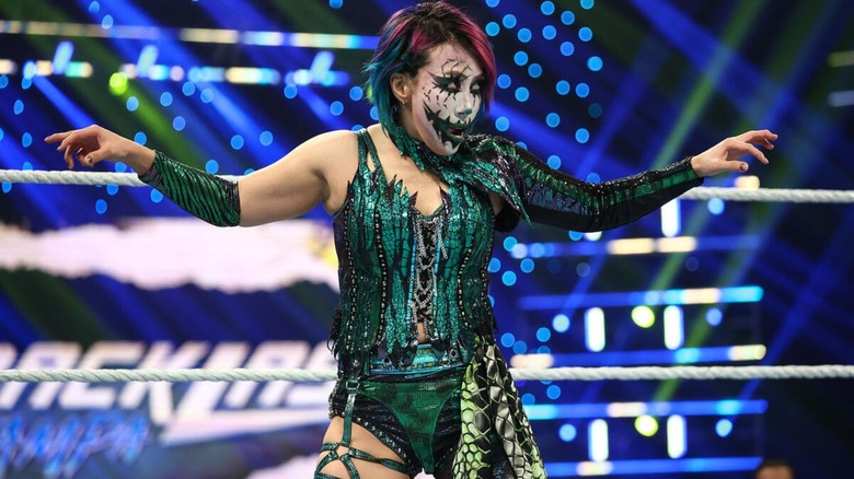Asuka poses in the ring before squaring up with IYO SKY in the ring during their match at WWE Backlash 2026.