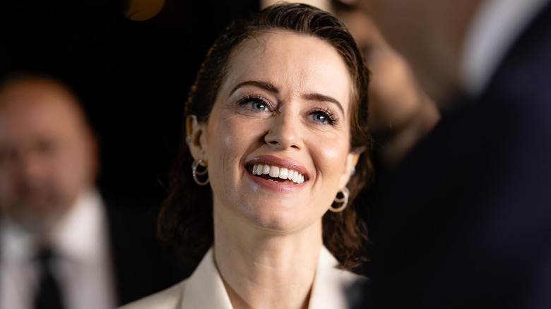Claire Foy smiling at a celebrity event