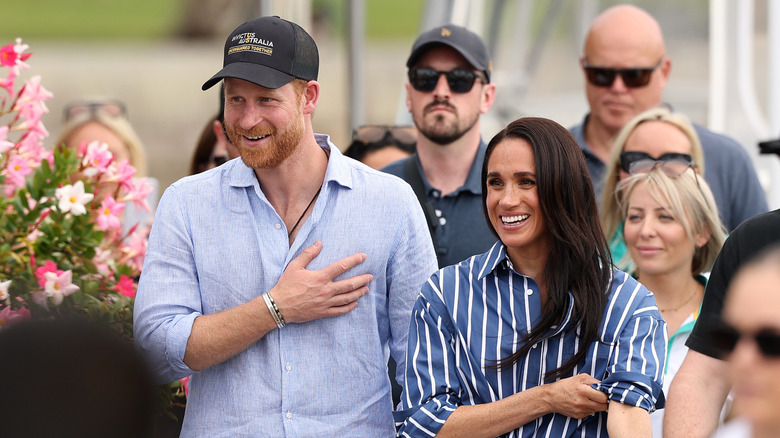 Meghan Markle and Prince Harry in coordinating striped outfit