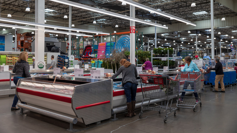 Customers shopping in Costco's food department