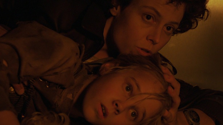 Ellen Ripley on the floor with Newt in Aliens