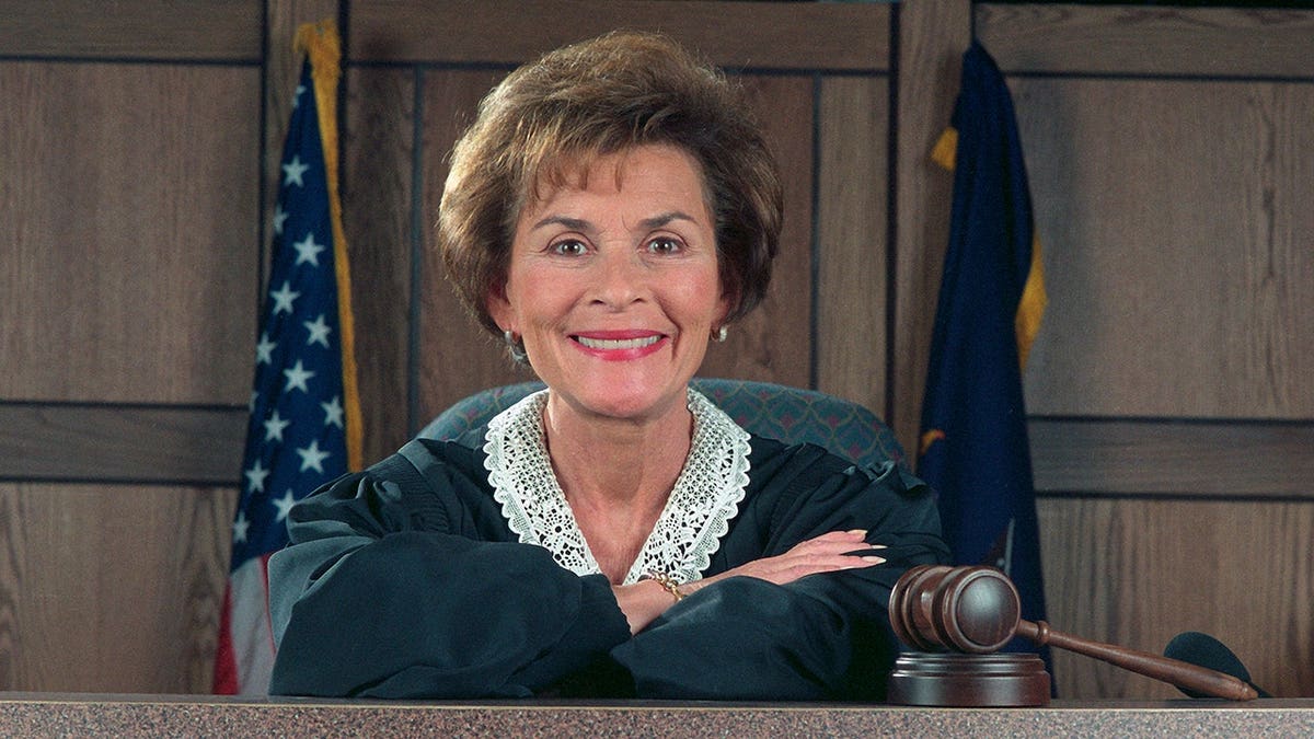 Judge Judy Sheindlin standing on the set of her television show