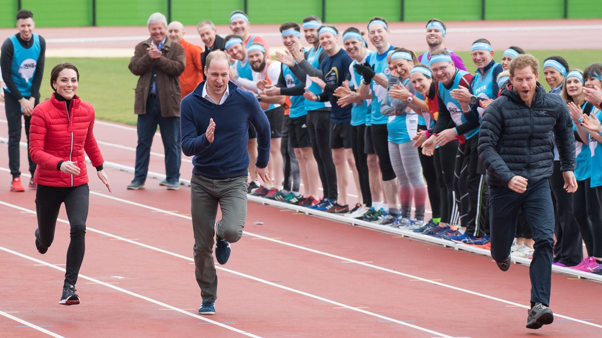 Catherine Duchess of Cambridge running with Prince William and Prince Harry at Olympic Park London