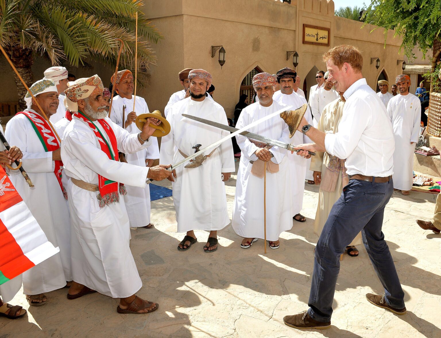 Prince Harry taking part in a traditional Omani sword dance during his tour of the Middle East. (2014)