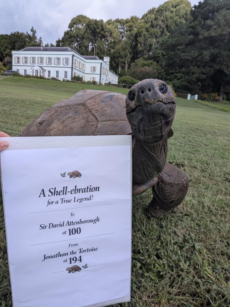 194 year old Jonathon the Tortoise (the oldest living land animal) wishes Sir David Attenborough on his 100th birthday: "Congratulations on reaching your 100th lap around the sun, young man!"