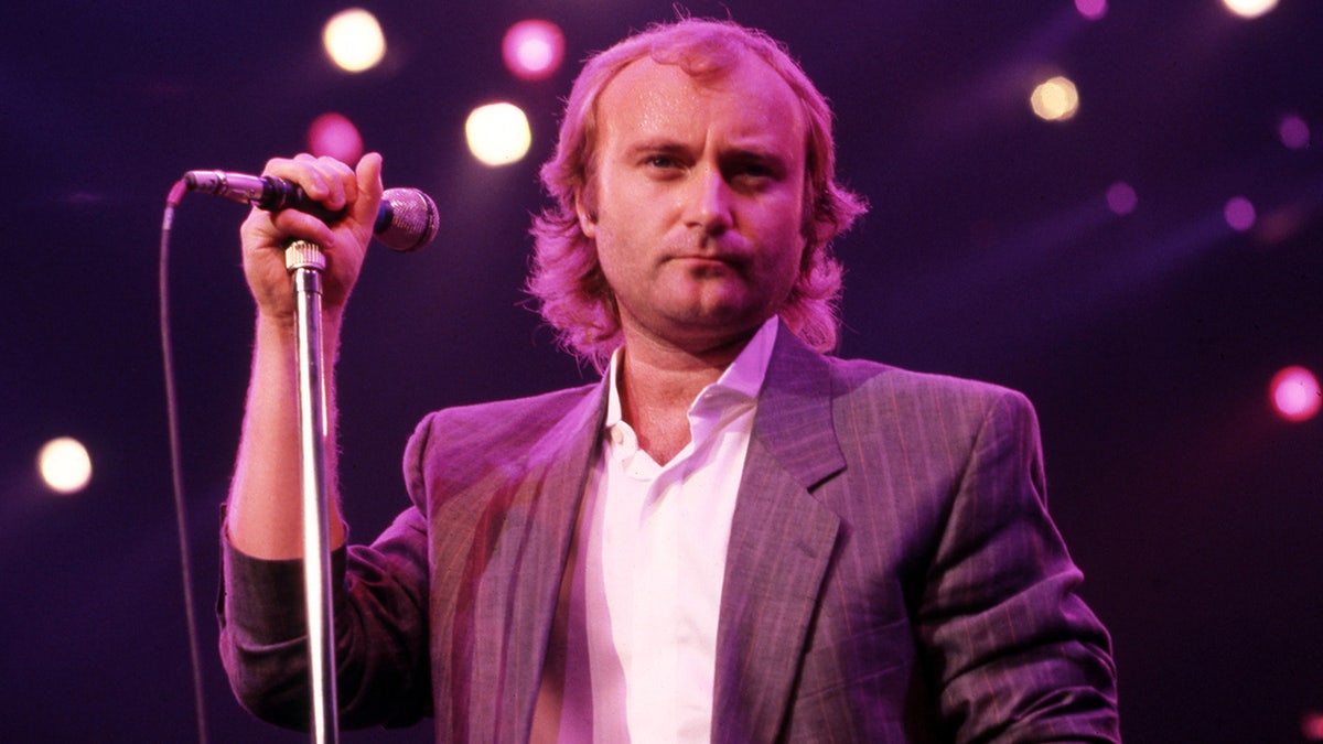 Phil Collins performing onstage at Joe Louis Arena in Detroit