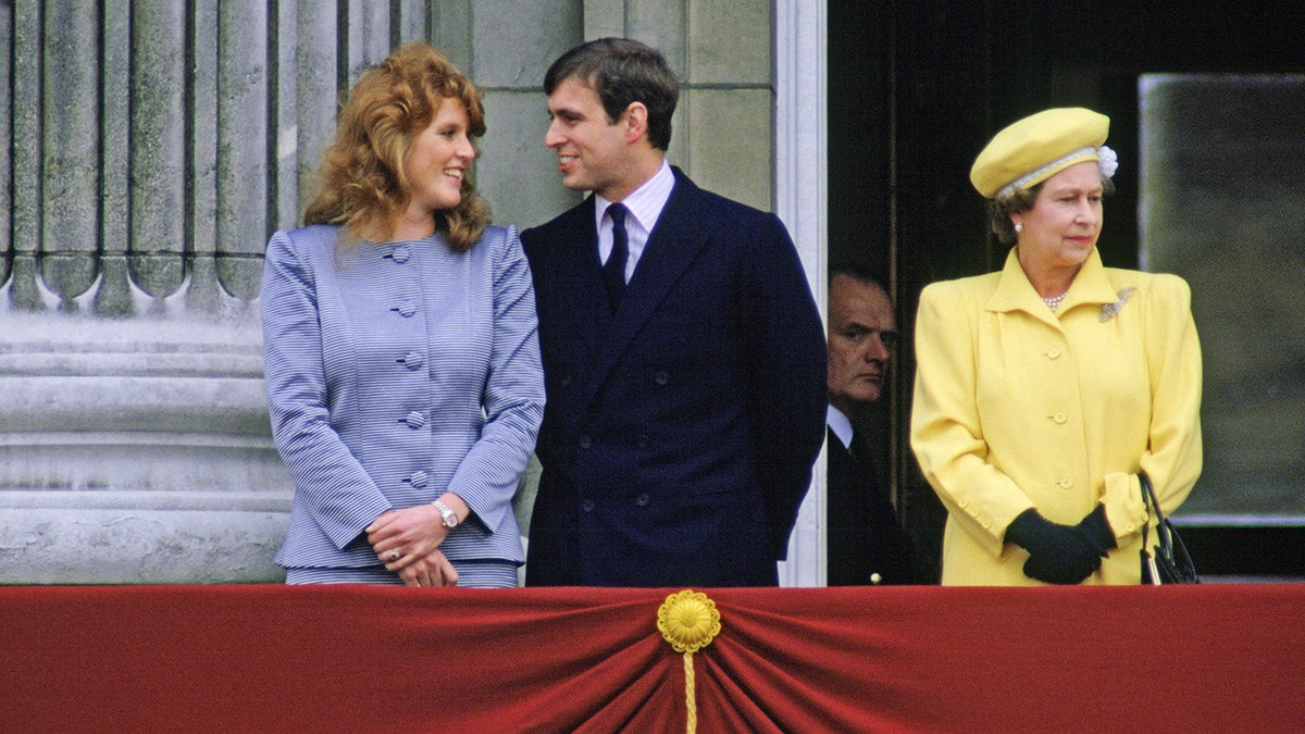Prince Andrew and Sarah Ferguson standing on Buckingham Palace balcony with Queen Elizabeth II