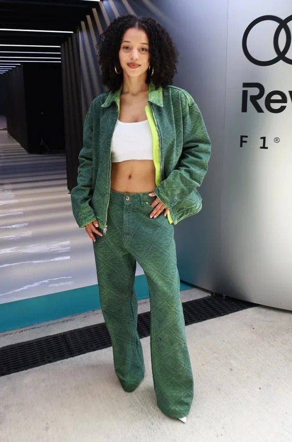 Chase Infiniti steps out in a coordinated green set with a cropped top for a modern trackside look.