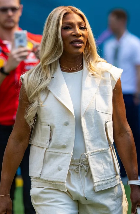 Serena Williams keeps it clean in a tailored cream vest and matching pants at the track