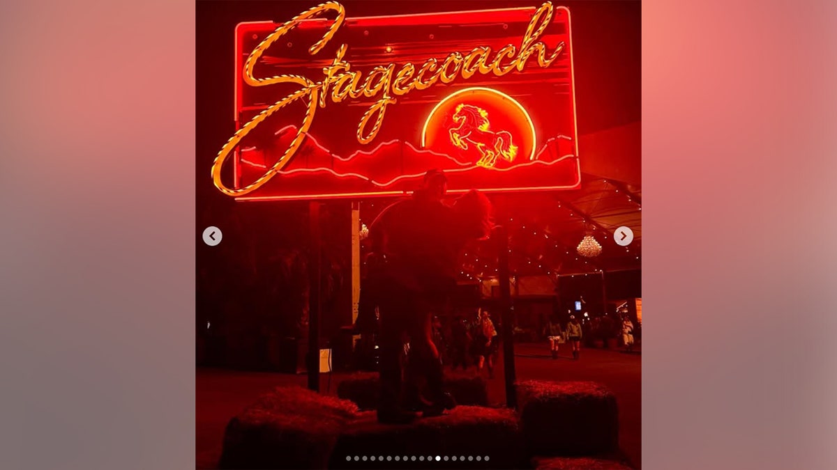 Scooter Braun and Sydney Sweeney posing in front of the Stagecoach sign at the music festival in April 2026.