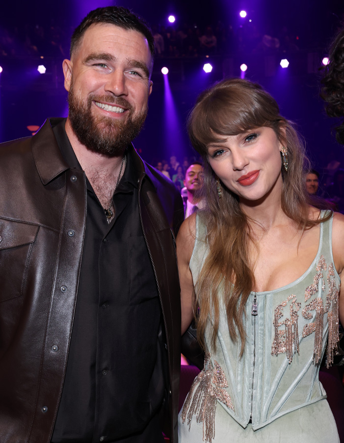 Taylor Swift wedding plans highlighted by guest drama at event with purple lighting